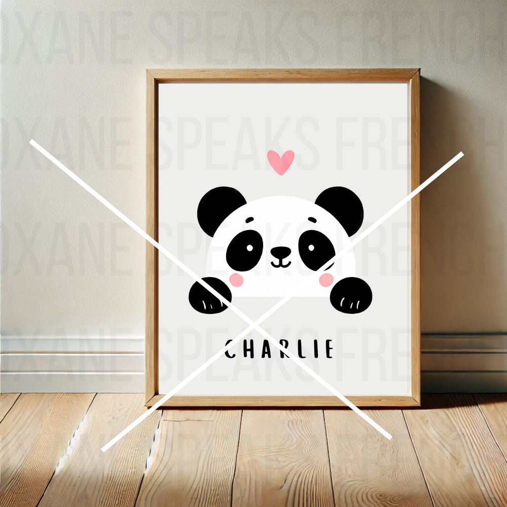 Framed panda wall art print on a wooden floor, personalized with the name 'Charlie' and a pink heart, ideal for nursery or kids' room decor