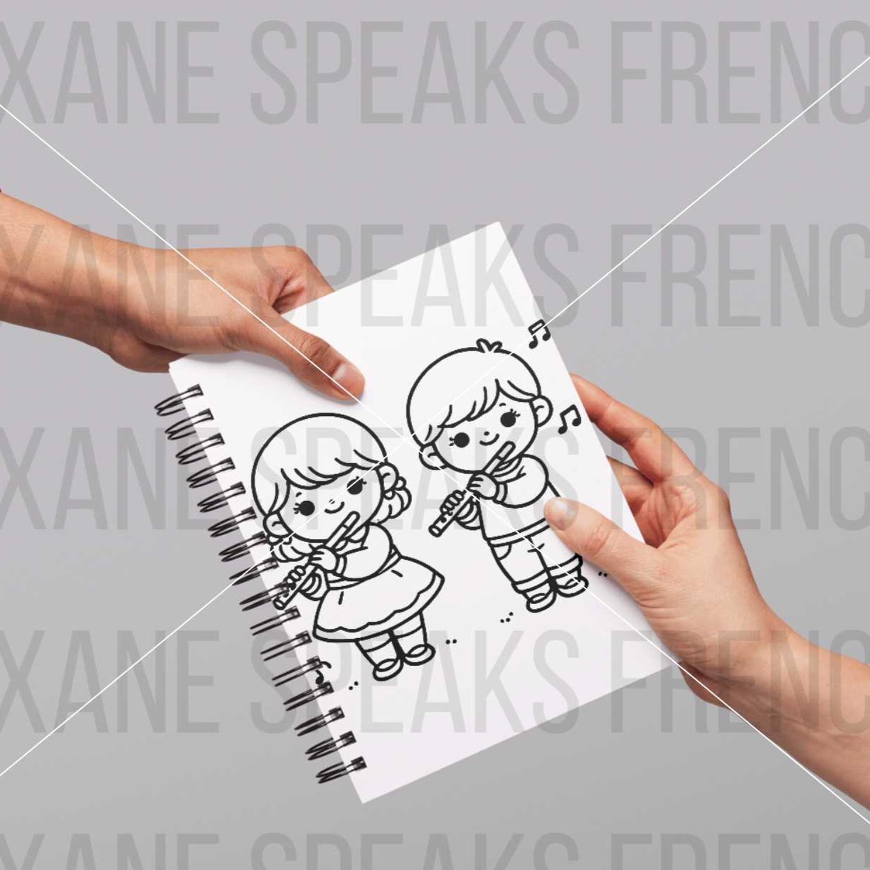 Hands holding a notebook featuring a Music SVG design of two children playing musical instruments. The girl is playing a flute while wearing a dress, and the boy is playing a flute while wearing a sweater and pants.